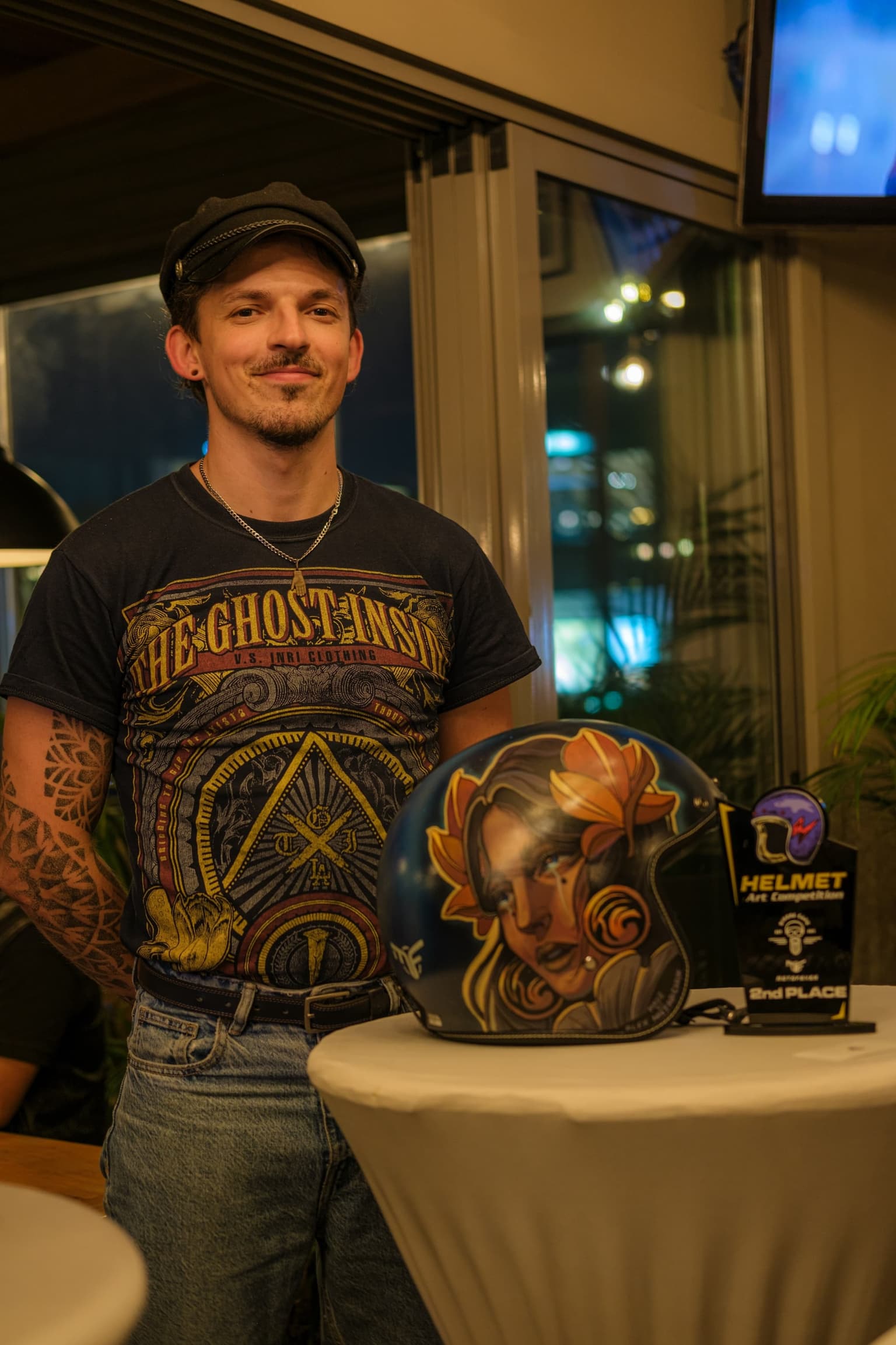 Artist presenting a painted helmet
